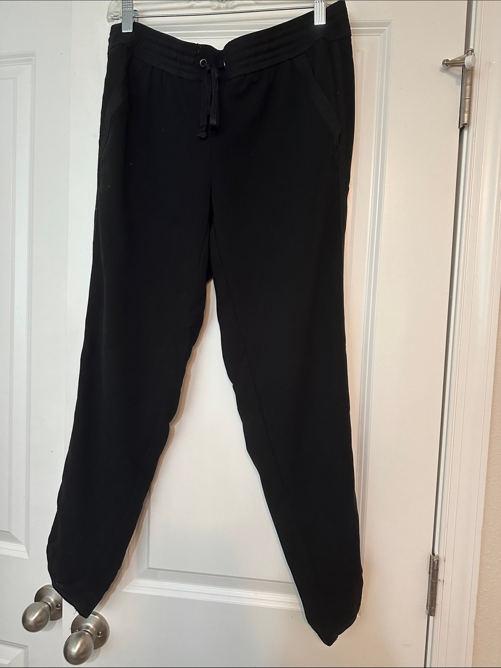 Size 2 black LOFT jogger pants soft fabric construction and a drawstring waist.